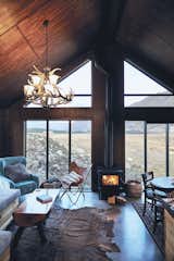 "With this cabin I wanted something that was robust, so you could enter after an outdoor activity, kick your boots off, start the fire and put some food on," says Kenny. "But at the same time have a feeling of space with the high ceilings, and some luxury and comforts of modern living like a nice shower and great water pressure."