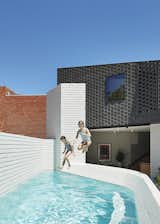 The architects made space for a petite pool in the new private courtyard, with a glimpse of the surrounding industrial buildings in the background.