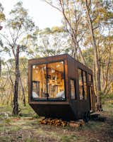 Fed up with modern-day society’s obsessive pursuit of things rather than lived experiences, Michael Lamprell, the designer of this cabin in Adelaide, Australia, set out to create an antidote to what he quips is a "craziness we’ve brought upon ourselves." In 160 square feet, CABN Jude&nbsp; includes space for a king-size bed, toilet, shower, heater, two-burner kitchen stove, full-size sink, and fridge. The interior is clad with light-colored wood, which helps to enhance the sense of space. Large windows bring plenty of natural light, while the clever design means everything the resident needs is within easy reach.