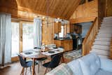 They replaced the dated carpeting on the main floor with engineered hardwood and left the unfinished stone flooring in the kitchen in place. The kitchen also got new hardware and lighting.