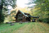 The 1,089-square-foot cabin sits on 1.5 acres of land.  Photo 2 of 11 in Budget Breakdown: A Creative Couple Rehab a Vermont Cabin for $18K