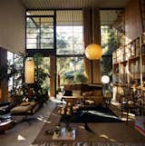 Living Room, Floor Lighting, Pendant Lighting, Coffee Tables, Chair, Sofa, Rug Floor, End Tables, Ceramic Tile Floor, and Bookcase In 1949, the Eameses designed and built their home in Pacific Palisades, California, as part of the Case Study House Program, and it has since become an icon of post-war residential design.  Photo 3 of 8 in Catch ‘The World of Charles and Ray Eames’ at the End of its Tour in Oakland