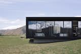 A Striking Black House Appears to Float in the New Zealand Mountains