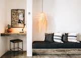 Bedroom, Bench, Bed, Ceiling Lighting, Chair, Pendant Lighting, Shelves, and Concrete Floor The sale includes all furnishings.  Photo 5 of 11 in Become a Hotelier in a Surfer's Paradise With This Chic Boutique Property Asking $2.6M