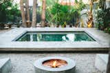 The concrete pool and firepit located in the communal courtyard.