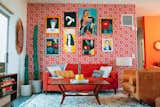 For an eye-catching display, Nagel installed paintings inherited by her grandmother against an accent wall covered in Hygge & West wallpaper. The orange and red pattern is called Arcade, and it was designed by Heath Ceramics.