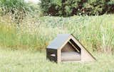Bad Marlon is a product design studio in South Korea that specializes in minimalist accessories for humans and their pets. The Deauville dog house combines plywood and powder-coated steel.