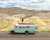 Fern the bus and Mande on the road in the Badlands.
