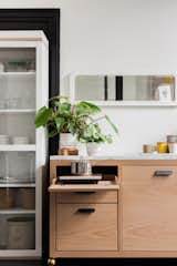 The kitchen unit combines an oak base with a marble counter, and was custom made by local furniture maker Walnut x Oak. "While we worked with Room &amp; Board and Article to furnish the majority of the space, it was also important to us to use local vendors and artists in decorating," says LaValle.&nbsp;