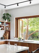 &nbsp;A pass-through window at the sink connects to the backyard.