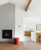 The fireplace was streamlined with plaster and a gas insert.