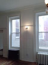 Before: These windows in the previous formal dining room were modified to create access to the backyard.