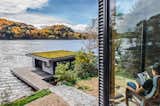 The roof of the carport forms a deck off the second-floor living and dining rooms. The deck also accesses the incredible lake views.