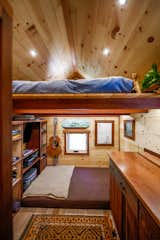 A sleeping loft perches over the living area in the Acorn.