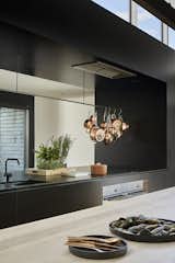 The kitchen faucet is the Vola KV1 mixer in black matte and the sink is the Abey SOHO Sink in black.