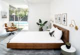 Two West Elm Pelle Sconces flank the Brayden Studio Horsham Platform Bed, while the sliding doors now reveal views to the restored backyard.