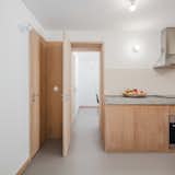 The door leads to an en-suite room that can be used for sleeping or set up as a dining room, as it is here.