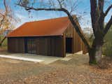 After: The barn’s original framing was kept for its agricultural character. Faulkner Architects applied an exterior envelope of salvaged redwood and added a Cor-Ten steel roof that will patina over time.