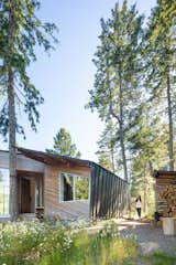 The firm juxtaposed a standing-seam metal envelope with thin strips of cedar on the exterior. “We're playing with the textures on the outside of the house,” says Campos, pointing out that the cedar brings a “human scale” to the industrial nature of the metal.