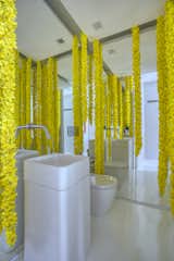 A powder room with whimsical flower garlands.