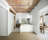The kitchen is a compact galley layout that includes the washer and dryer.