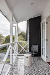 A balcony off the bedroom wing overlooks the street and sports a tiled floor.