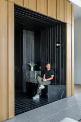 Black Nero Marquina marble makes for a sculptural entry bench.