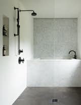 The wet room has a venetian plaster wall finish and 2" marble hex tile for a backsplash. The floors are also plaster.