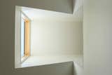 The new dormer acts as a skylight for the living room, and also brings light to the upper level, thanks to a cut-out in the hallway.