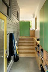 This reconfigured Craftsman home in Portland, Oregon, designed by Beebe Skidmore Architects, includes a highly functional mudroom. The exterior siding and windows were kept in place to reference the house’s previous incarnation. Built-in cabinetry with exposed plywood edges and laminate fronts are now up to the task of handling the family’s gear. The mudroom has sight lines to the family nook at the back corner.