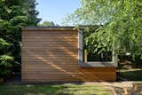 Now, there’s an office space and a sauna inside a small backyard shed, which delivers privacy to occupants. The materials and oversized window visually connect the smaller structure to the new facade of the main building. 