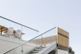 The staircase, with precast concrete steps, now leads down to the future pool terrace. "We sought to connect the spaces so the family could be relaxed and meander barefoot through the property," says Wittman.  