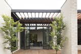 A wood pergola offers coverage while allowing light to filter inside.