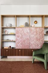 Sliding doors crafted from Marblo conceal the television