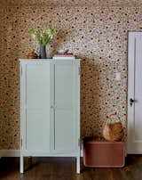 The cabinet has an antique look, but it was designed and painted by Zachary.