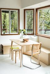 Gibson built a window bench out of birch plywood and that was paired with an Ikea table and a vintage Cesca chair by Marcel Breuer in the dining nook.