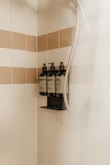 Products from Rudy’s Barbershop, which started in Seattle in 1993, are available in the shower.
