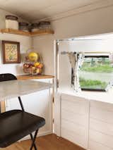 "Because our whole life had to fit in about 160 square feet of livable space, and because that life had to endure bumps, bounces, and vibrations, it was incredibly important to have good organization," says Timothy. Overall, containers and racks totaled $350. 