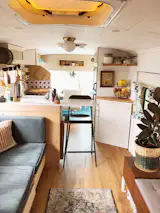 The materials for the couch totaled $710, and included baltic birch plywood for the carcass, oak trim and slats, upholstery, and drawer slides for the storage units underneath. The IKEA globe ceiling light in the kitchen was $20, while recessed overhead lights from Amazon cost $60.