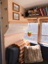 "[The couch is] built in three sections, and all three sections are on 300-pound drawer slides," adds Timothy. "So, you can pull it out either into an L-shape or a U-shape, or into a full double bed."