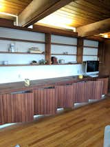 During: Fawcett spent four days refinishing the 16-foot original mahogany unit that lines one wall in the living room.