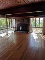 Before: The bank of windows in the living room, and the way the sunlight filtered through the tree leaves, is what first drew Alex to the house.