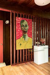 Now, the home reveals itself in layers. "Those who know me are aware of my love of strange and creepy portraits," says Alex of the artwork.