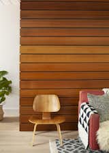 The accent wall was rebuilt with stained rift-sawn white oak; each plank was handpicked by Reeves and the homeowner for their grain pattern.