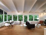 A series of windows connect the interior with the forested park that borders the .34-acre property.