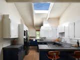 The kitchen is made light and bright with a skylight at the ceiling.