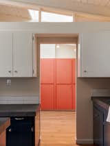 A view into the utility room, with its contrasting cabinetry.