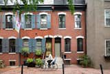Architect Lauren Thomsen of Lauren Thomsen Design bought this 1836-square-foot brick row house in Philadelphia in 2018. In the ensuing remodel, the exterior façade was updated in accordance with the Philadelphia Historic Commission guidelines, and the front door painted 'Connected Gray' by Sherwin Williams.