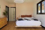 Accent walls in the bedroom are painted in Backdrop’s ‘Harajuku Morning’ and the bed is the Floyd Platform Bed.