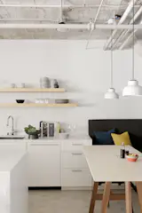 Ann Sacks Savoy field tile in Chalk lines the backsplash, and concrete tile from Clé covers the floor.